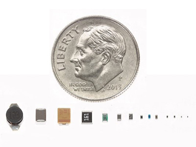 Examples of Intricon microelectronic design and high volume assembly the microminiature size compared to the size of a dime. 