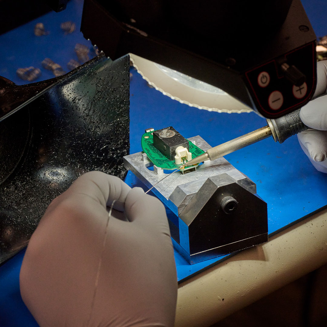 Our Services Page37d someone working on microelectronic components